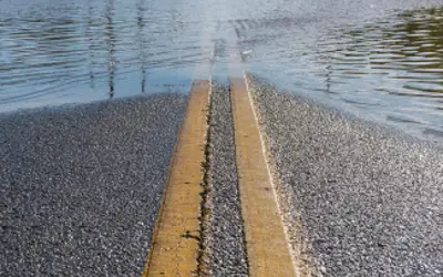 Water overlaps a road